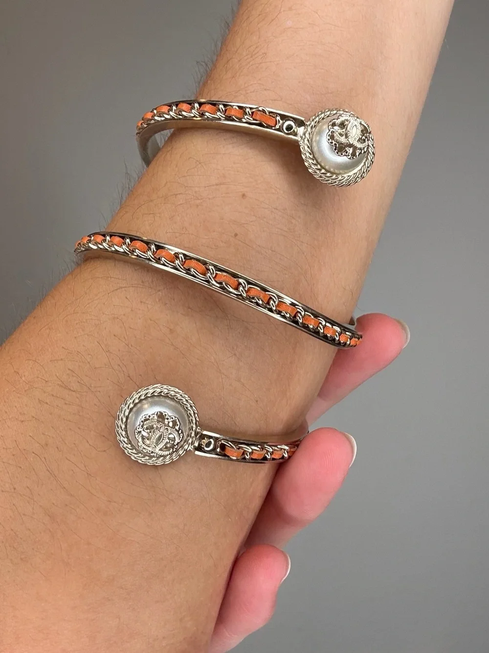 CHANEL Cruise 2018 Gold-Tone Spiral Cuff Bracelet with Orange Leather Accents